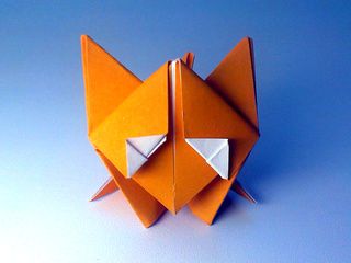 A cute origami fox standing on ice