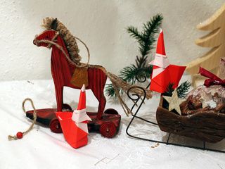 A very beautiful Christmas scene with 2 Smiling Santa Claus origami models