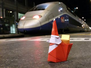 Origami Smiling Santa Claus takes the TGV (French high speed train)